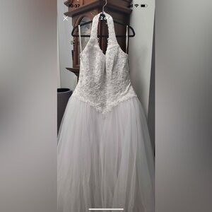 NWT Halter style wedding dress, by David’s Bridal. Size Women’s 14, true white.